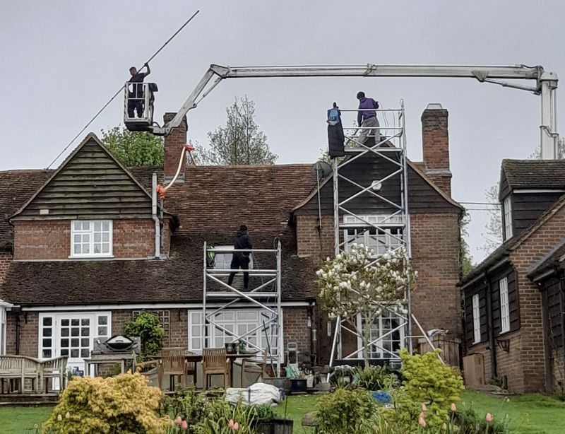 The Roof Moss Cleaners using cherry picker and scaffolding to clean roof safely and professionally in Totton, Hampshire