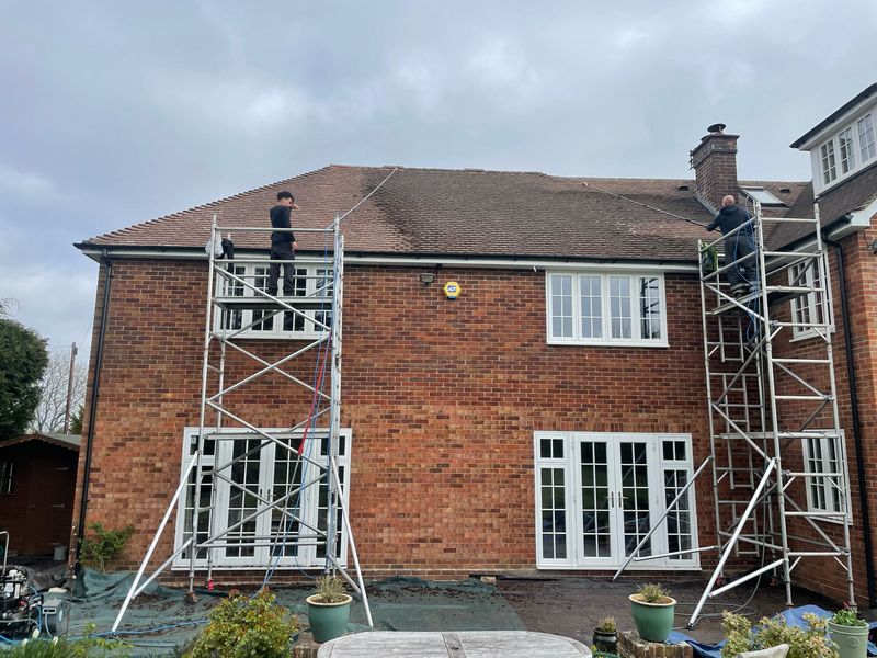 Roof cleaning carried out safely from scaffold towers by The Roof Moss Cleaners in Totton